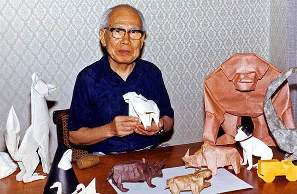 Akira Yoshizawa with origami-animals Akira Yoshizawa with origami-animals